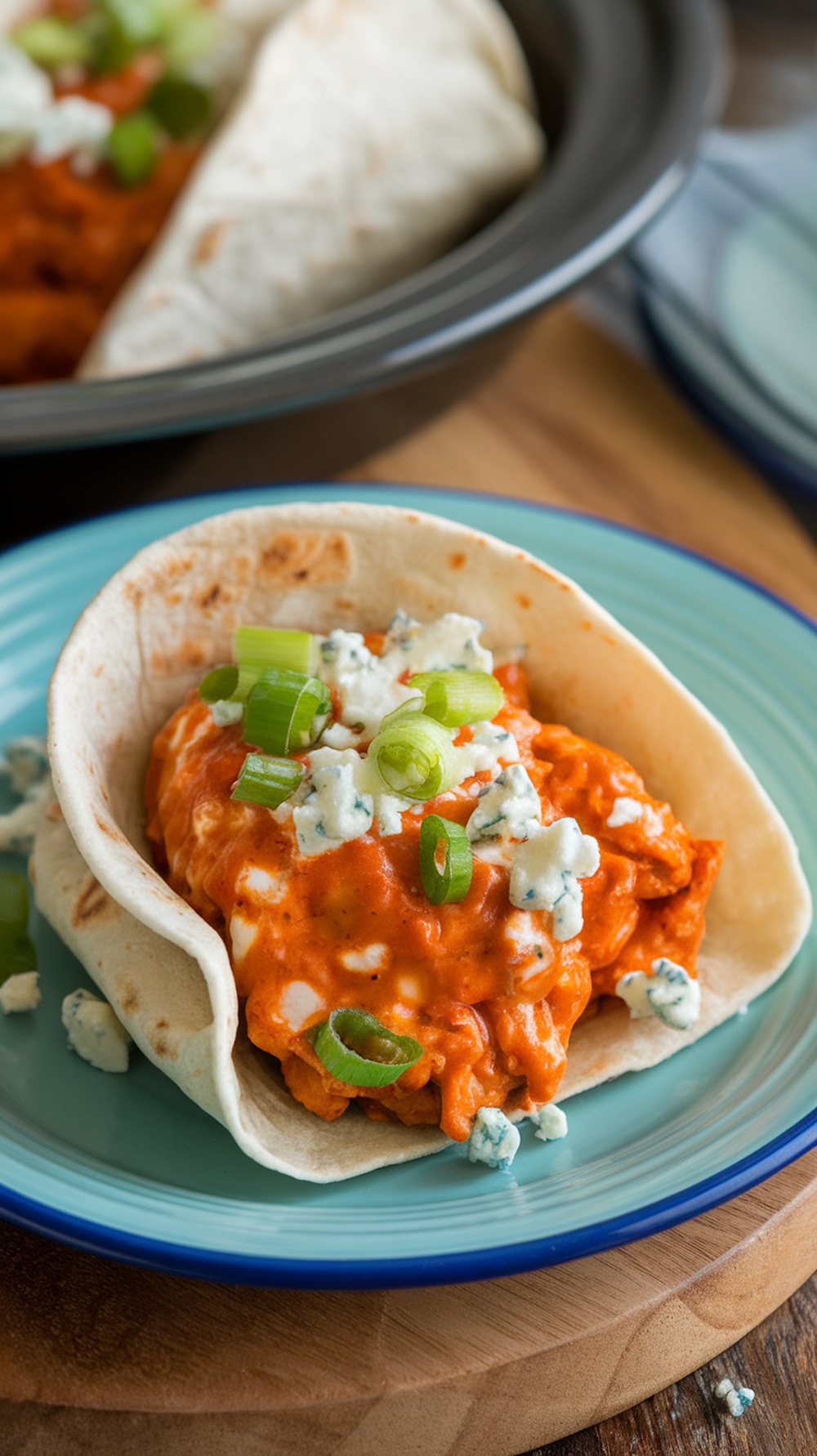 Buffalo chicken tacos with blue cheese and green onions